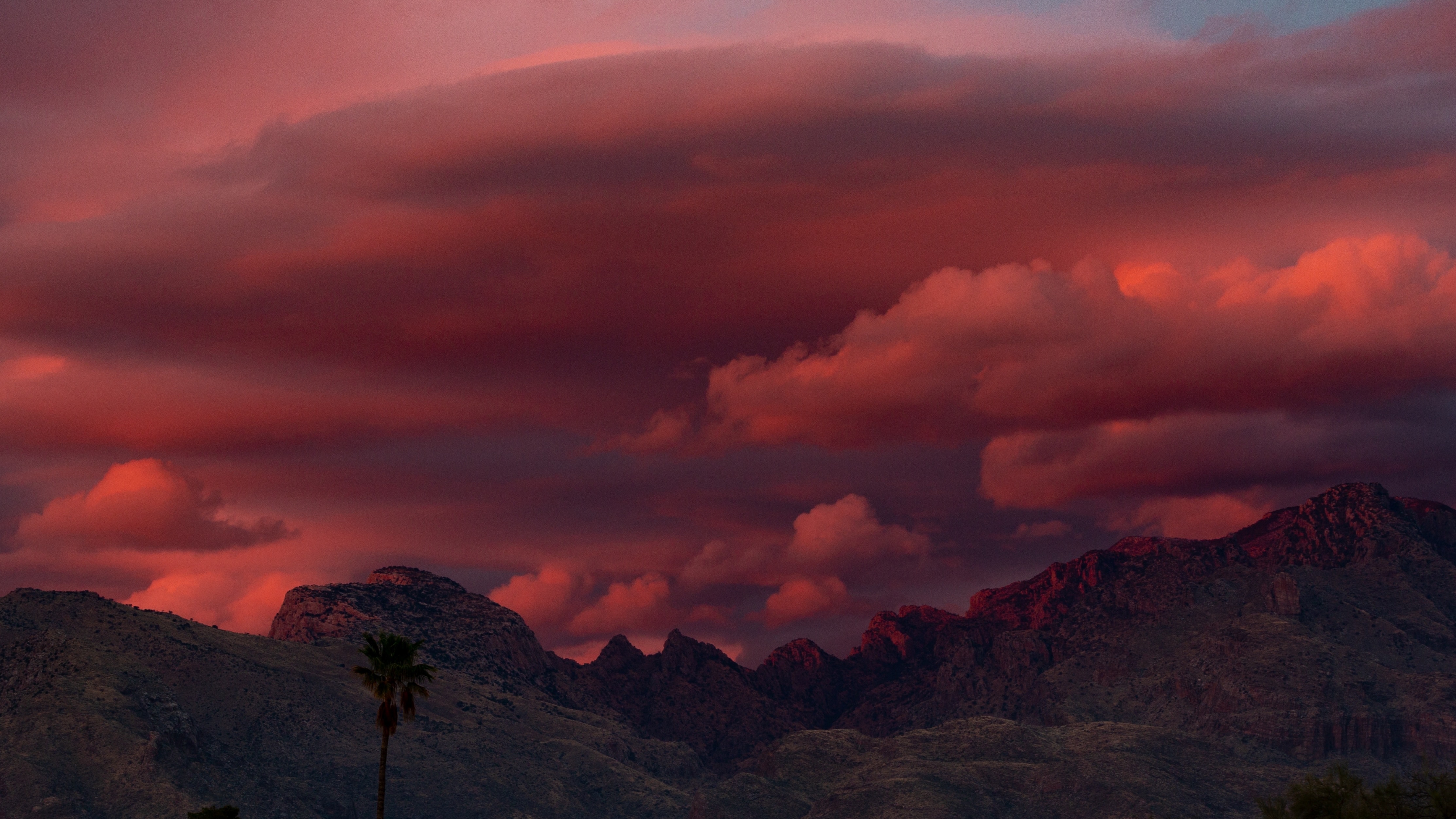 Red sunset clouds over the Santa Catalina Mountains in Tucson